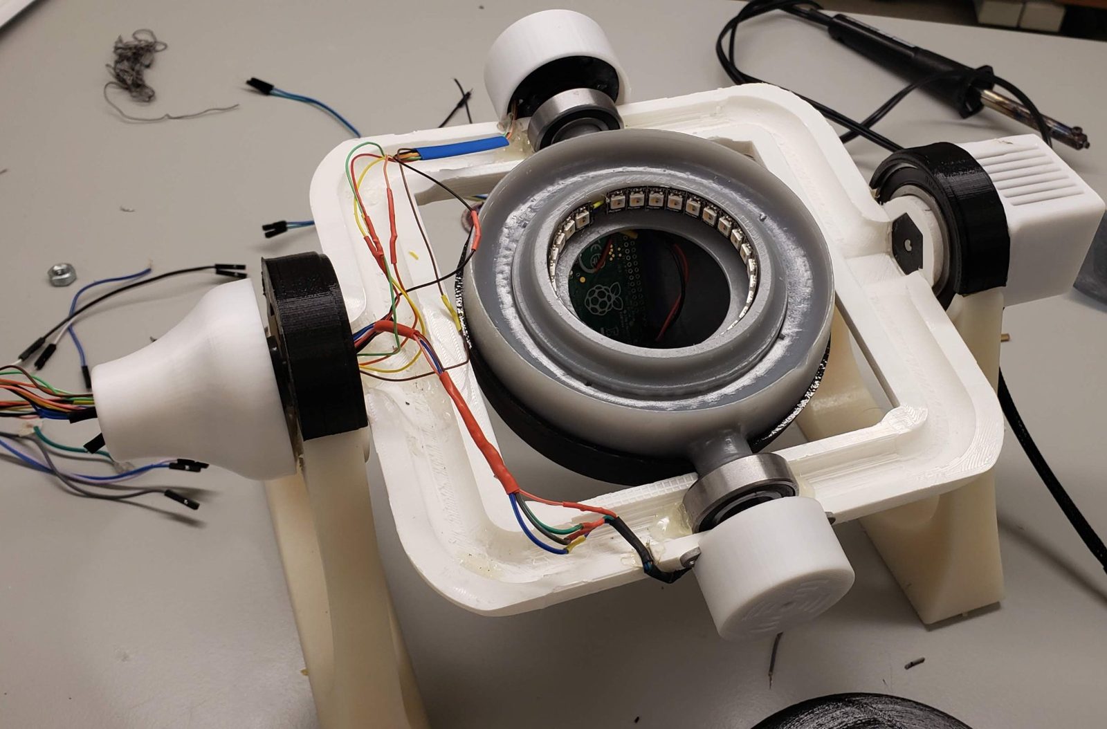 The second prototype with the core open, showing the LED ring around the aperture and a Raspberry Pi Zero with its camera inside the chamber